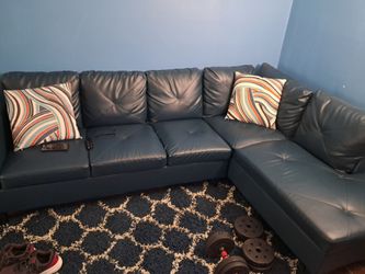 L - Shaped Sectionals plus the Rugs