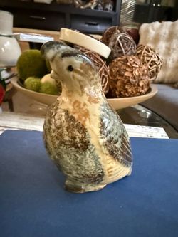 Vintage Ceramic Quail Figurine Vintage ceramic quail figurine has a mottled brown, green, and cream glazed finish. This pottery bird statue is crafte