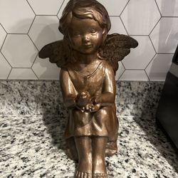 Sitting Angel holding A Dove