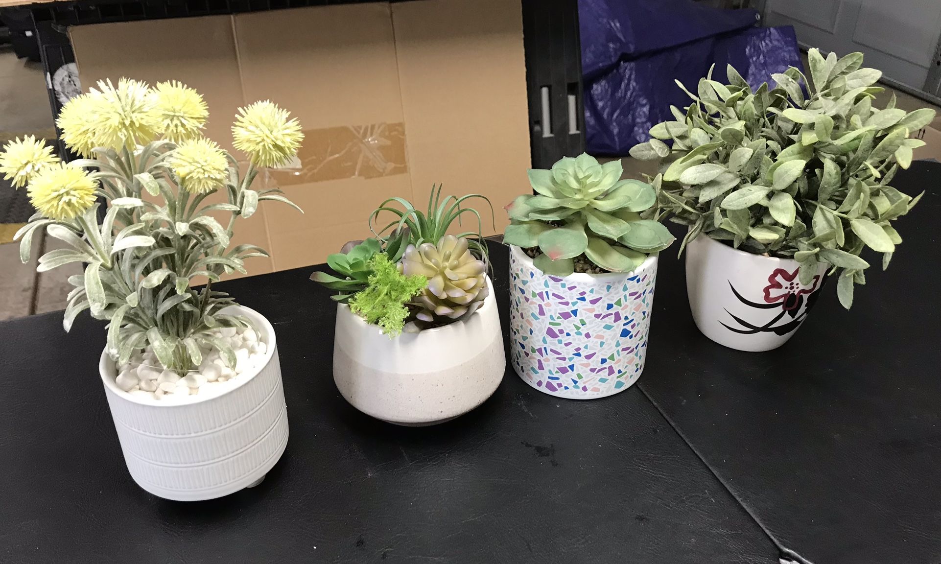 4 life-like faux succulent arrangements