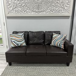 New Dark brown faux leather sofa with missing left armrest. 65 inches long.