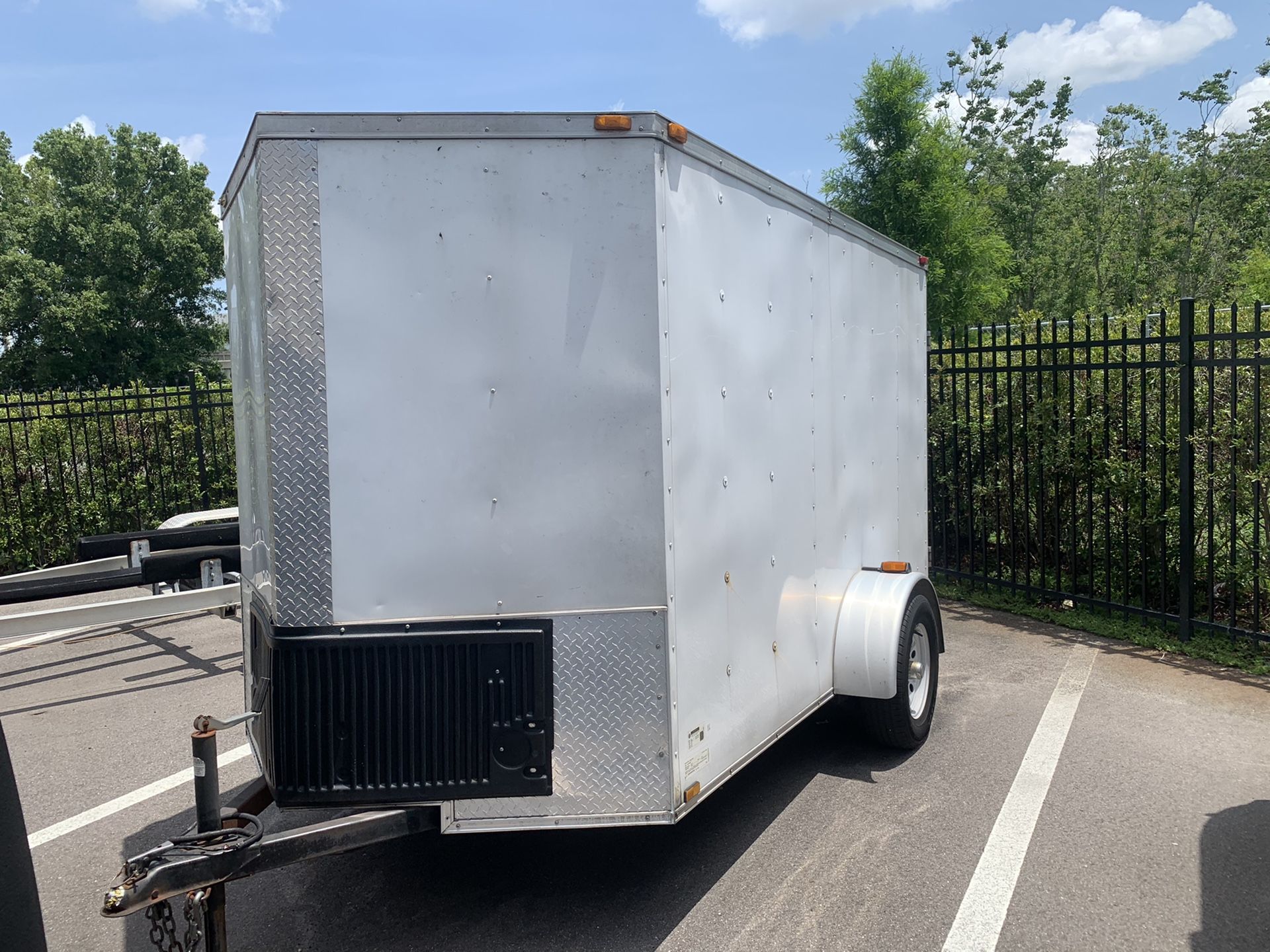 6x10 cargo trailer with barn door and custom extension to the roof.