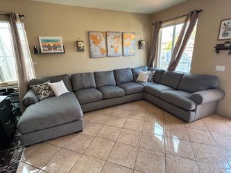 Beautiful abd super comfortable grey sectional couch from Jerome’s