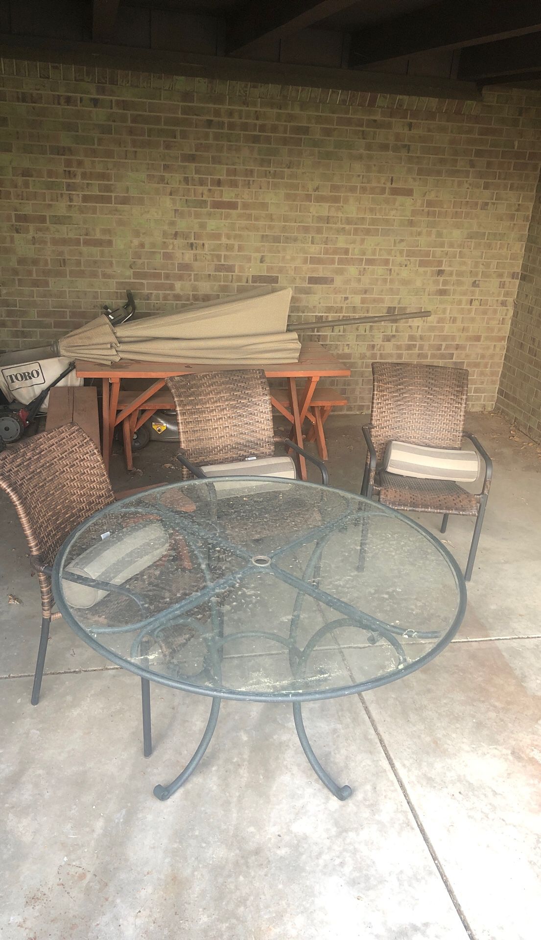 Patio set with umbrella and stand.