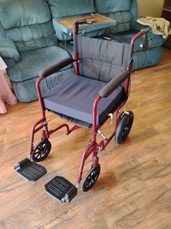 Foldable wheelchair, extra pad, foot rests fold, swing, and remove