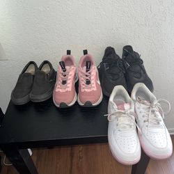 black adidas , black vans , pink Nikes , and white and pink Nikes.