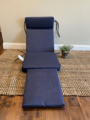 Photo ONE Chaise lounge cushion with ties in blue. Has a attachment to add for foot rest. Without footrest measurements are- 4’2” x 20.75” attachment is 19