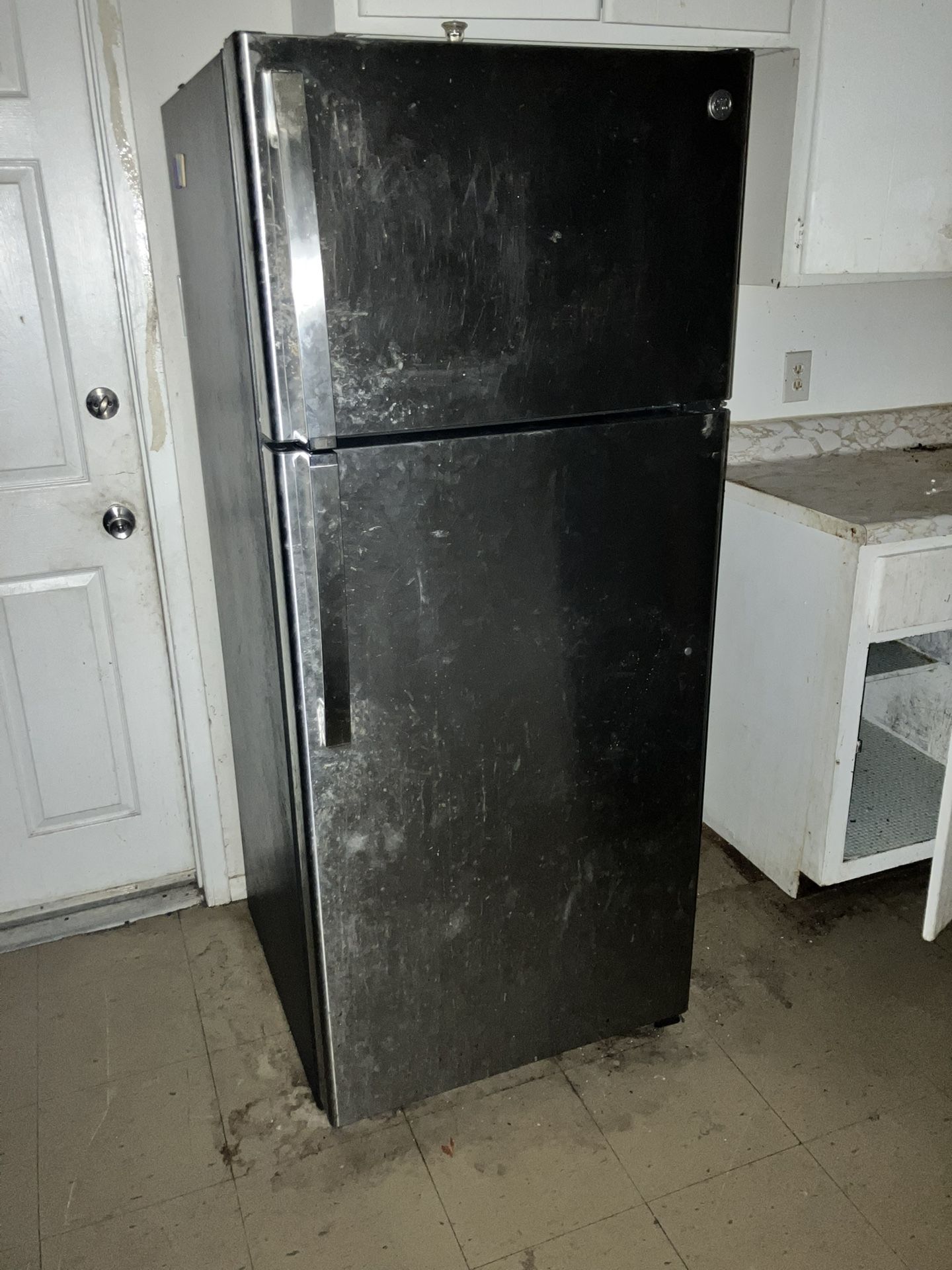 GE® 18.3 Cu. Ft. Black Top Freezer Refrigerator