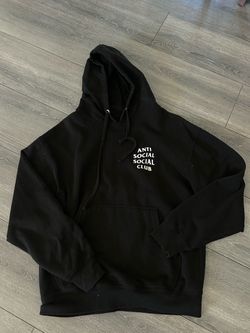 black ASSC hoodie, worn lightly