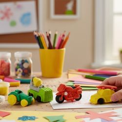 (Lot Of 4) 3D Puzzle 1" Miniature Multi-Color Erasers Figural Motorized Vehicles. The image displays a set of 3D puzzle erasers shaped like various ve