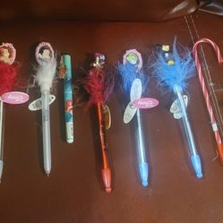 collection of Disney character jiggly feather pens, some of which are vintage and light up when pressed. 
The collection includes various characters s