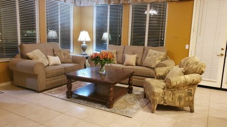 Beautiful Tommy Bahama style family room the big couch is also a sleeper matching loveseat and comphy chair tables not included.