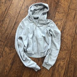 Size small.  Grey cropped Brandy Melville hoodie!
