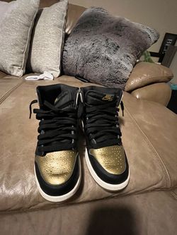 Air Jordan 1 Mids in the Black & Metallic Gold colorway