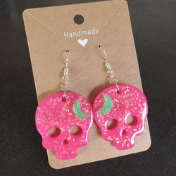 Neon pink faux opal skulls Halloween dangle earrings with green moons glow in the dark 
