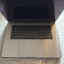 Apple MacBook Pro 15” (2017 Model) 2.8 GHz. Quad Core Intel I7 16gb Ram 250GB Hardrive  has Touch Bar and Touch ID 