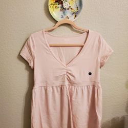 Light pink top is the Easy Short-Sleeve Babydoll Top from Hollister Co.