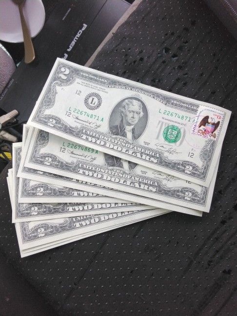 2 Dollar Bills With April 13th 1976 Stamp On Them