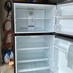 GE 21.9 cu. In. Black refrigerator model year