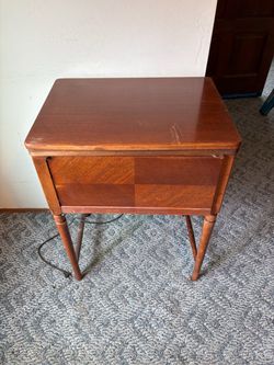 Antique sewing machine and cabinet