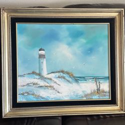 coastal lighthouse among sandy dunes