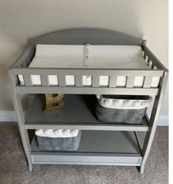 Changing table with storage shelfs
