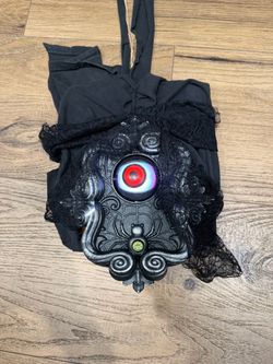 Audio Black lace scary doorbell eyeball Halloween door decor with lace top with red eye graphic and silver swirls #goth #alternative #halloweendecor