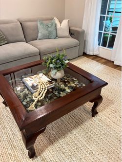 Solid wood coffee table with glass inset top