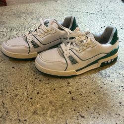 ouis Vuitton LV Trainer sneakers in white and green. 