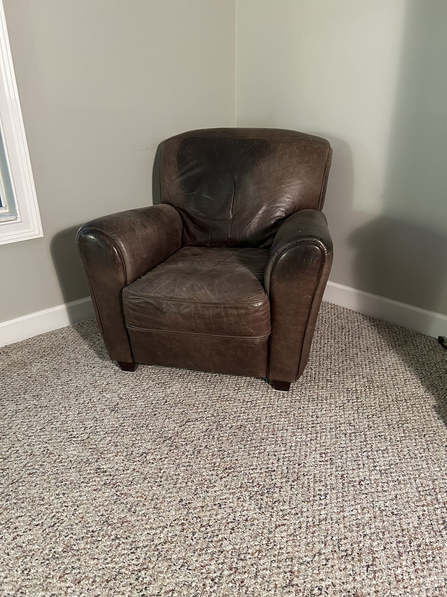 2 Genuine Italian leather lounge chairs and 1 ottoman I