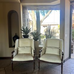 traditional high-back accent armchairs with a classic wingback silhouette and solid carved wood frames Chairs 