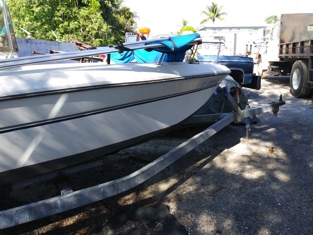 18 ft boat ...needs battery is in a yard ..and i need it gone...for 1200...sold the house dont have room for it .. have a spare motor for parts ...
