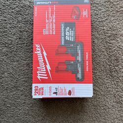 2 Milwaukee Battery 5 Ah M12 + Charger (Brand New, Sealed in box)