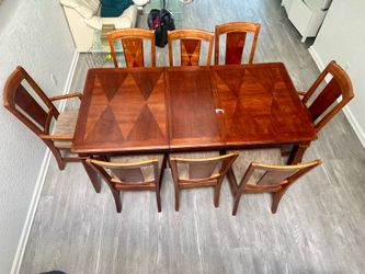 Dining table and 8 Chairs set. No tears, rips, stains in the upholstery. Some scuffs, dents, discoloration, wear and tear from years of use but overal