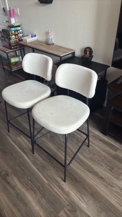 White clothe bar stools