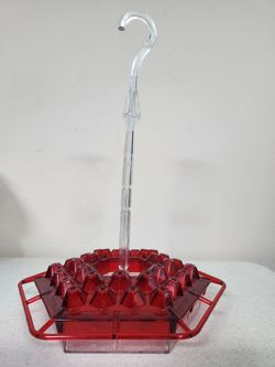 Hummingbird feeder in all plastic 13.5" inch tall with a red 30-hole hexagonal 9" wide base and 13" inch long clear plastic hanging hook. Hook twists 