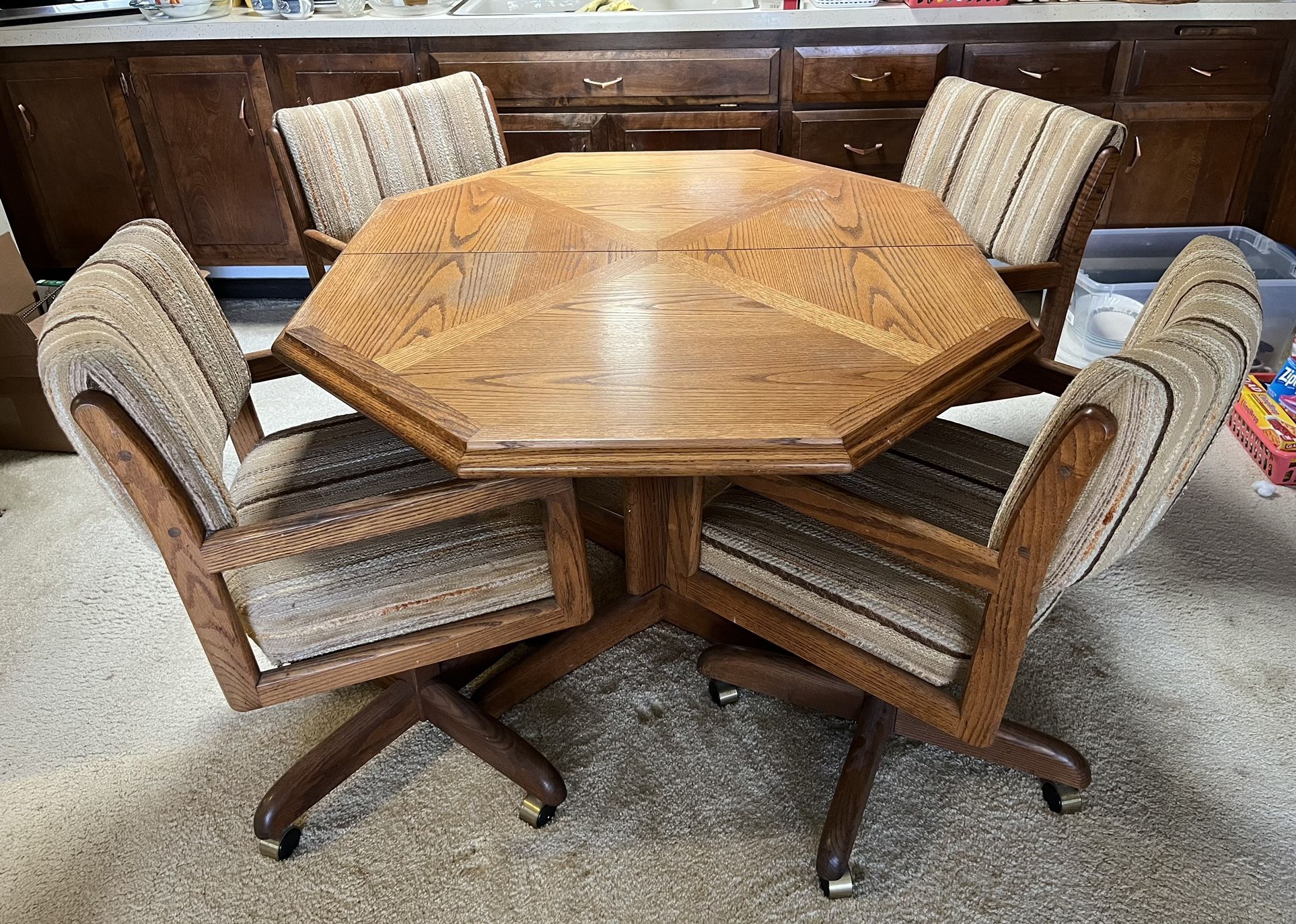 Wooden Game or Kitchen octagonal table with 4 rolling chairs on castors