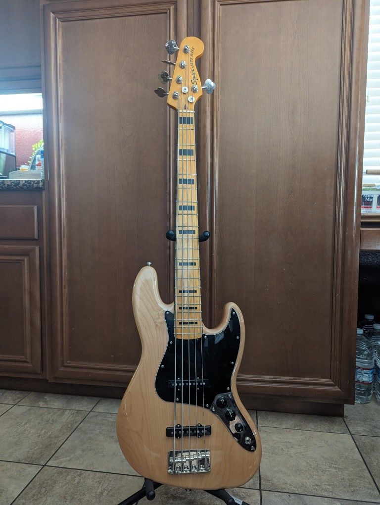 Squire 70's Vibe 5 string Jazz Bass w/ hard shell case, strap and Ernie ball strap locks. 