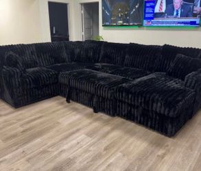 NEW IN BOX - Black Sectional With Pull out bed and STORAGE CHAISE** Finance Available $54 down