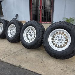 17" KMC rims w- 33" Goodyear Wrangler MT tires 