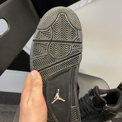black cat jordan 4’s 