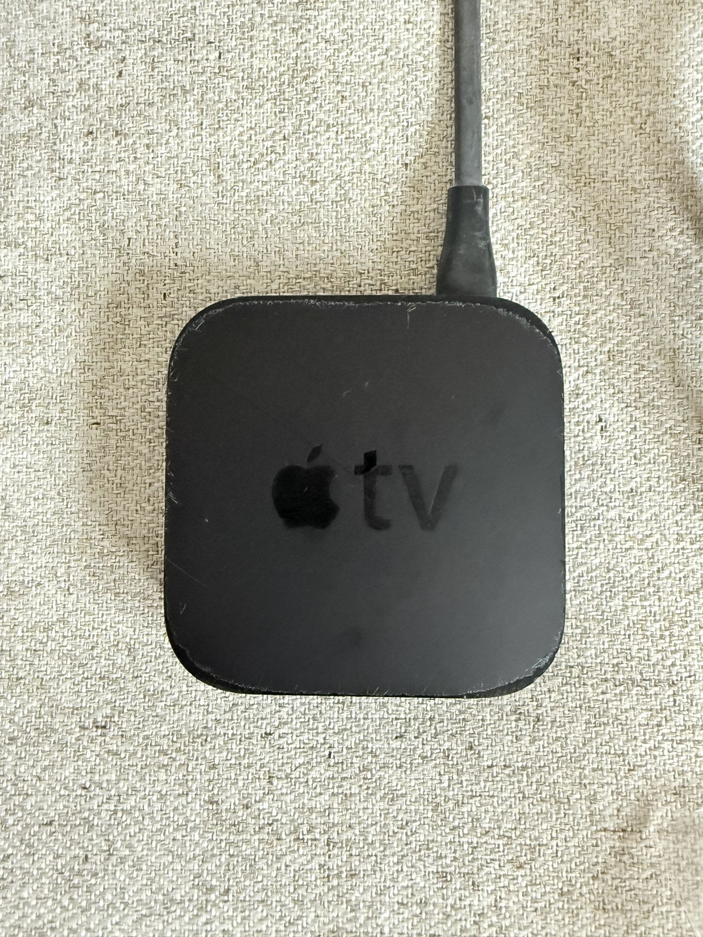 The Apple TV A1469 3rd Generation WiFi Media Streamer with Power Cord and Remote Control is a sleek and powerful digital HD media streamer. With a sin