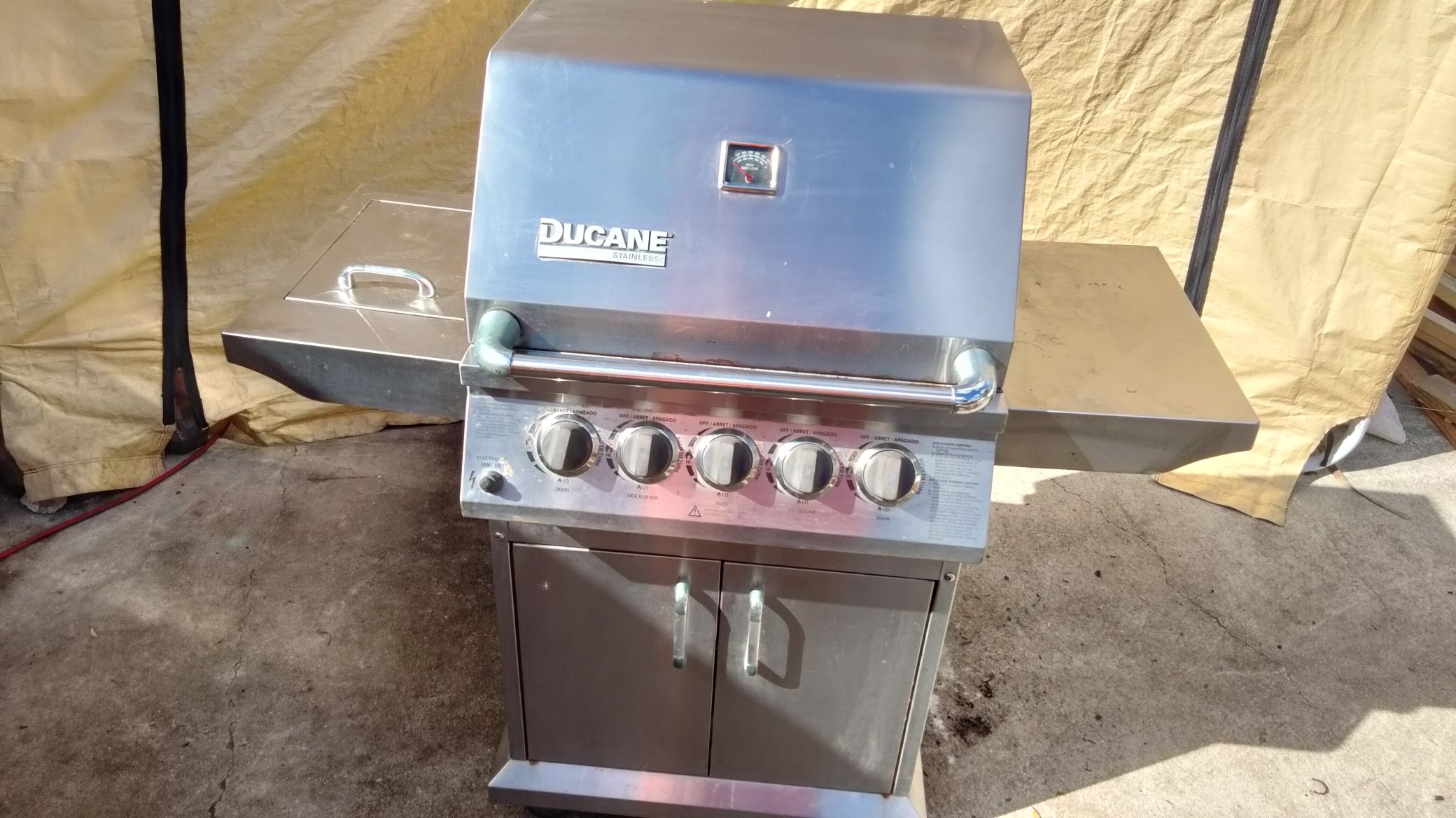 Ducane stainless steel propane grill with cover $100