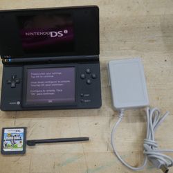   Nintendo DSi Black With Stylus Game Super Marion Bros Charger - Tested and Works used. tested. in a good working order. factory reset was done.  