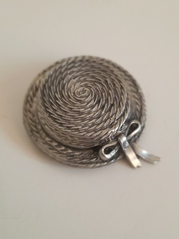 Silver and pewter hat brooch