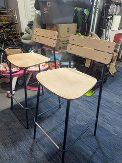 2 matching bar stools. Sturdy and good condition. Seat 31in tall