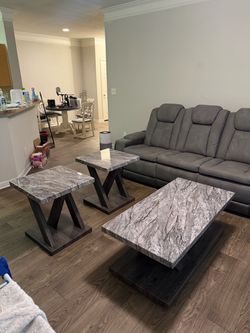 Stain preventing couch with tables.
