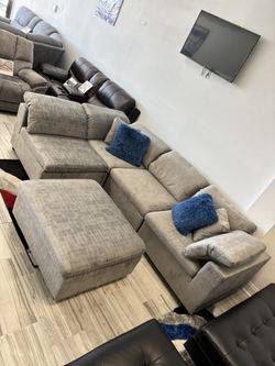 Spring Blowout Sale. Ibiza Gray Sectional With Ottoman Only $899. Easy Finance Option. Same-Day Delivery.