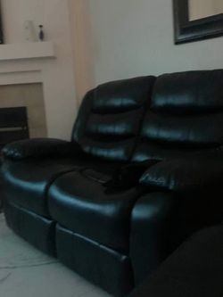 2 black leather couches
