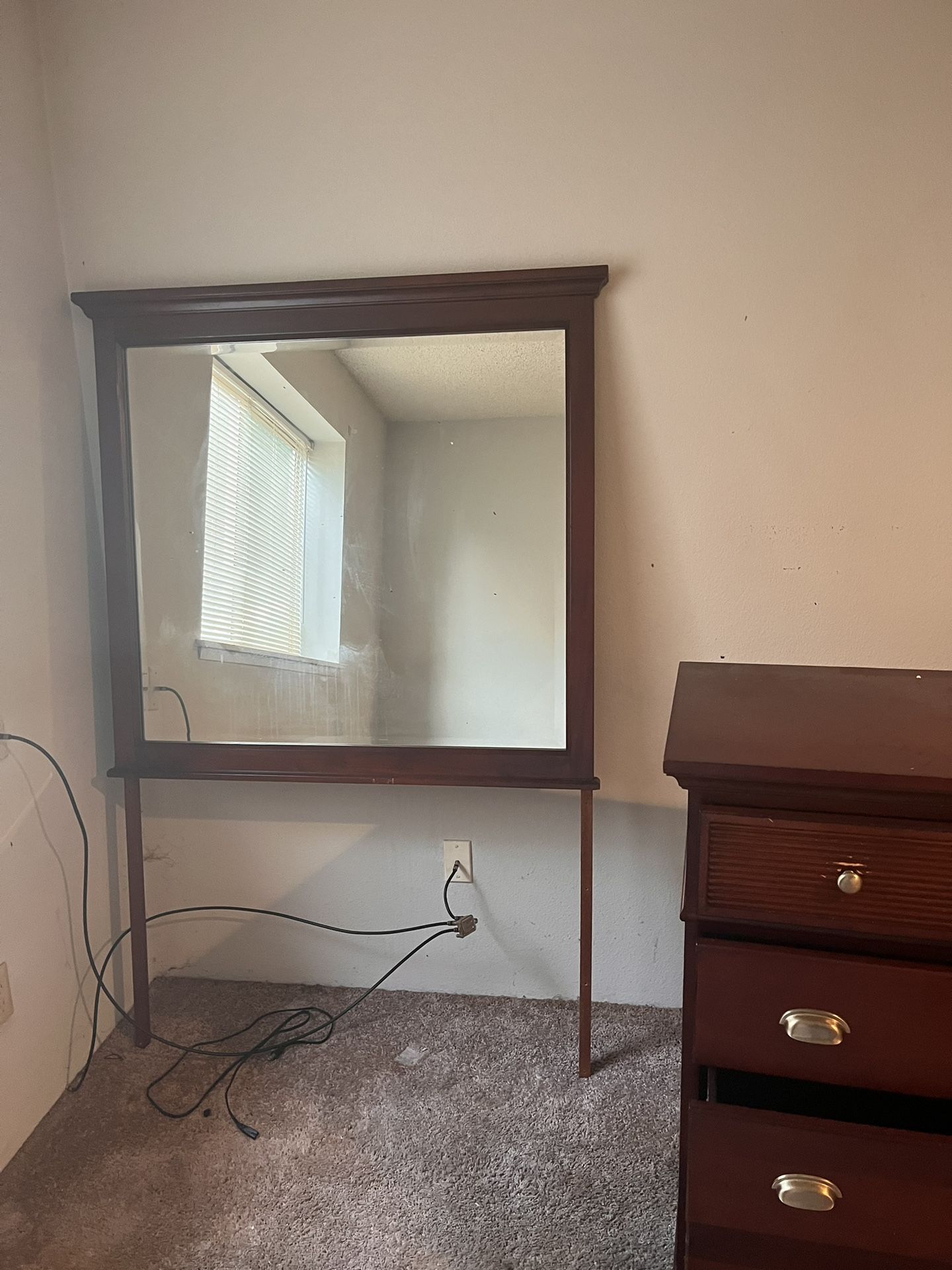 Dresser with attached mirror